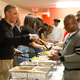 Then-President Barack Obama and family serve Thanksgiving meals to homeless and at-risk veterans at Friendship Place in Washington, D.C., on Nov. 25, 2015. Earlier in the day, Obama participated in the annual turkey pardon at the White House. (Martin H. Simon-Pool/Getty Images)